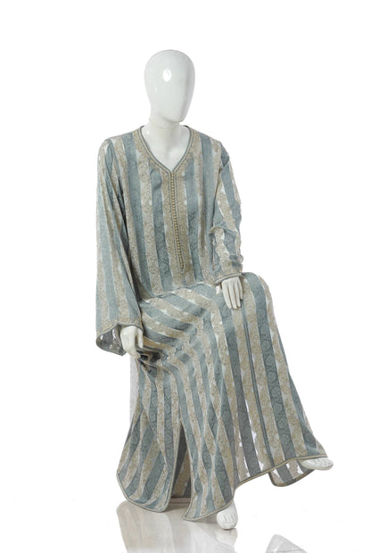 Luxury Green Moroccan Kaftan for Women – Jawhara Silk Brocade Design with Silver Embroidery, Sitting Mannequin Display | قفطان مغربي فاخر جوهرة أخضر للنساء من بروكار الحرير بتطريز فضي، معروض على مانيكان جالس