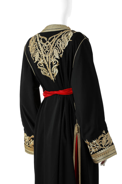 Yaqut Marrakesh Moroccan Kaftan in Black Silk Crepe with Gold Embroidery and Crimson Under-Kaftan – Luxury Women’s Dress Back View Showing Flowing Silhouette and Elegant Design | قفطان مغربي ياقوت مراكش من حرير كريب أسود بتطريز ذهبي وقفطان داخلي قرمزي – فستان نسائي فاخر من الخلف يظهر التصميم المتدفق والأنيق
